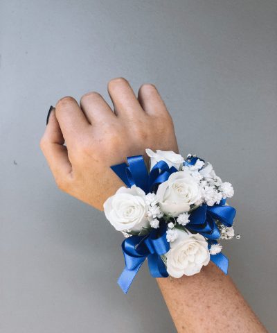 White Wrist Corsage with blue ribbon