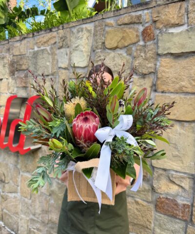 Native flower arrangement with protea and seasonal foliage by The Lush Lily
