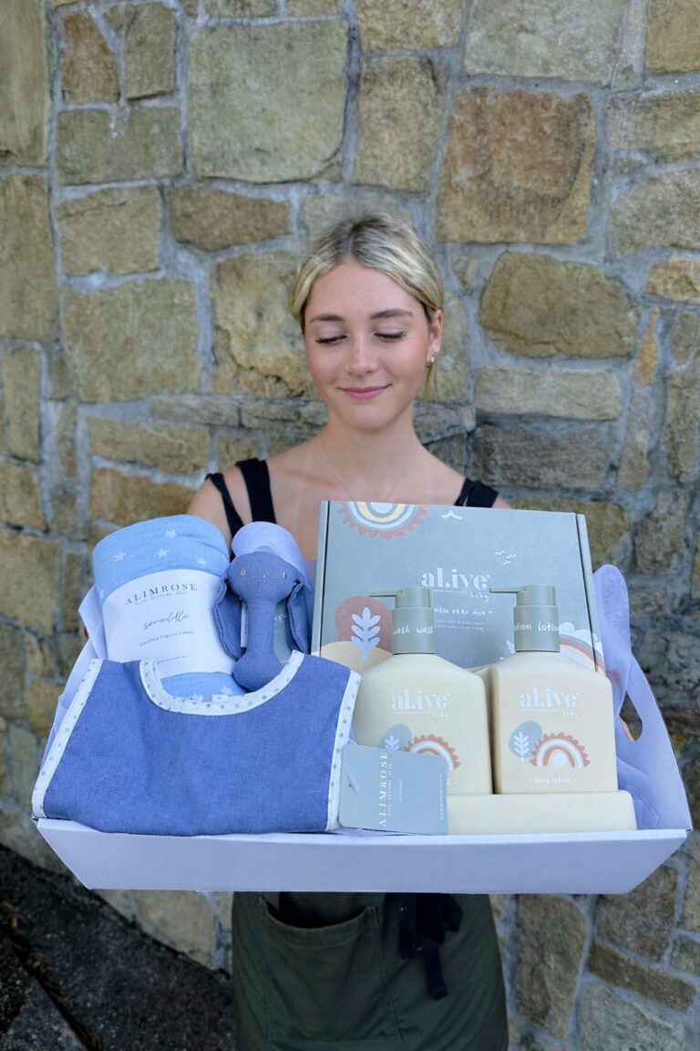 Little Dreamer Baby Hamper featuring Alimrose baby bib, swaddle and rattle with al.ive baby wash and lotion, beautifully gift wrapped