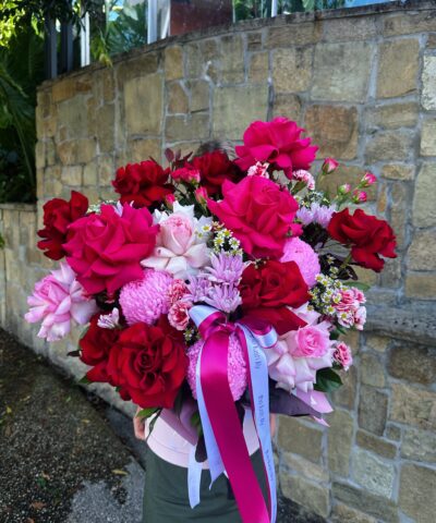 Cupid’s Signature luxury rose hatbox featuring red, blush and hot pink flowers by The Lush Lily Brisbane florist