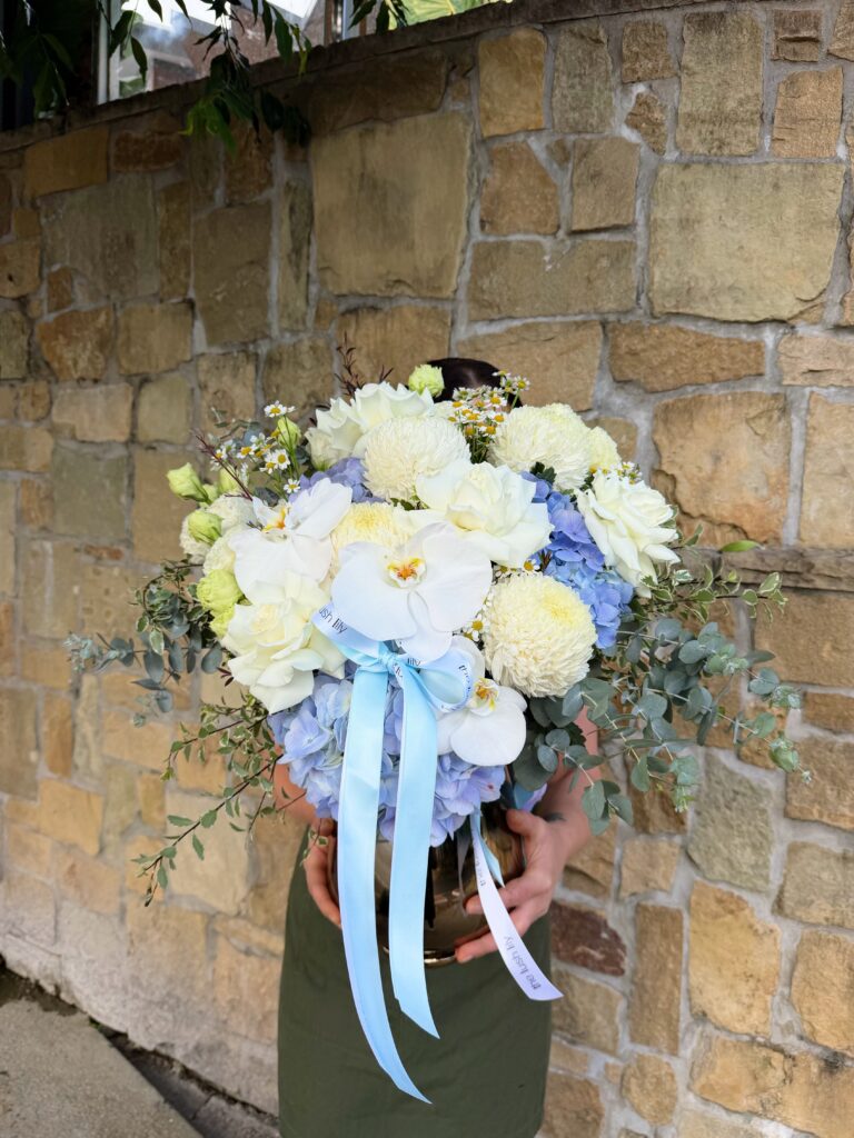 Baby Blue Bliss vase arrangement with blue hydrangeas, white roses and orchids – Brisbane flower delivery