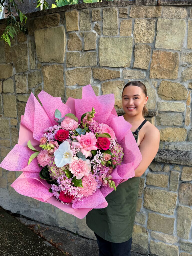 Pink Paradise luxury bouquet featuring pink roses, orchids, chrysanthemums and premium seasonal flowers by The Lush Lily