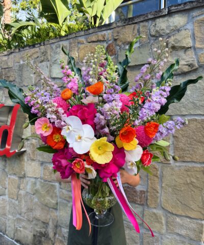 Poppy Party colourful flower vase arrangement with poppies, orchids, roses and seasonal blooms in pink, orange, yellow and lilac