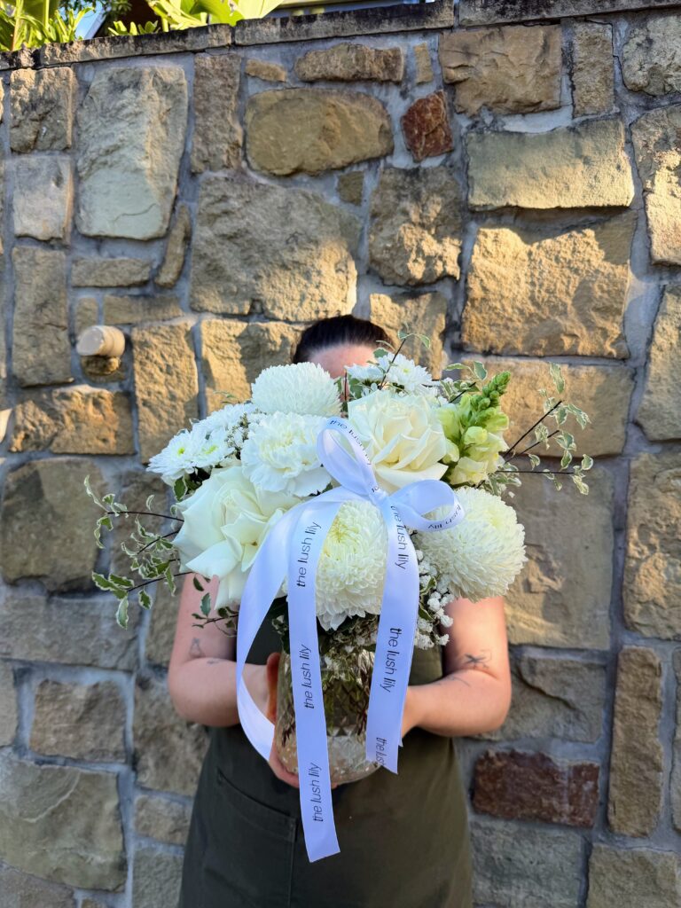 Simply White elegant white flower vase arrangement with roses and seasonal blooms by The Lush Lily Brisbane