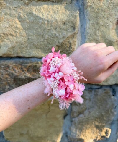 Pink preserved wrist corsage with dried flowers and pink floral details
