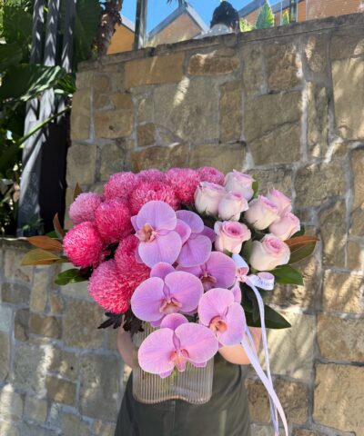 Orchid Crush pink orchid flower arrangement with roses and disbuds in glass vase